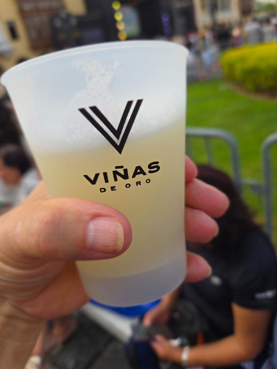 A banner for the Lima Pisco Sour Festival, a close-up of a Pisco Sour drink, and two selfies of the author enjoying the festival atmosphere with crowds in the background.