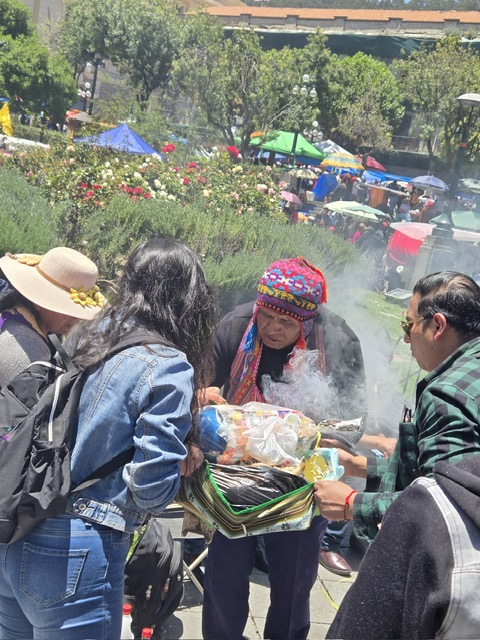 Traditional shaman bestowing blessings with incense at the festival