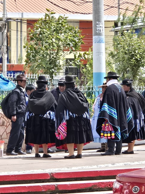 Traditional Bolivian cholitas gathered on a La Paz street corner
