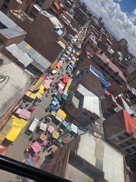 Sprawling La Paz market seen from the gondola above, colorful stalls stretching for blocks