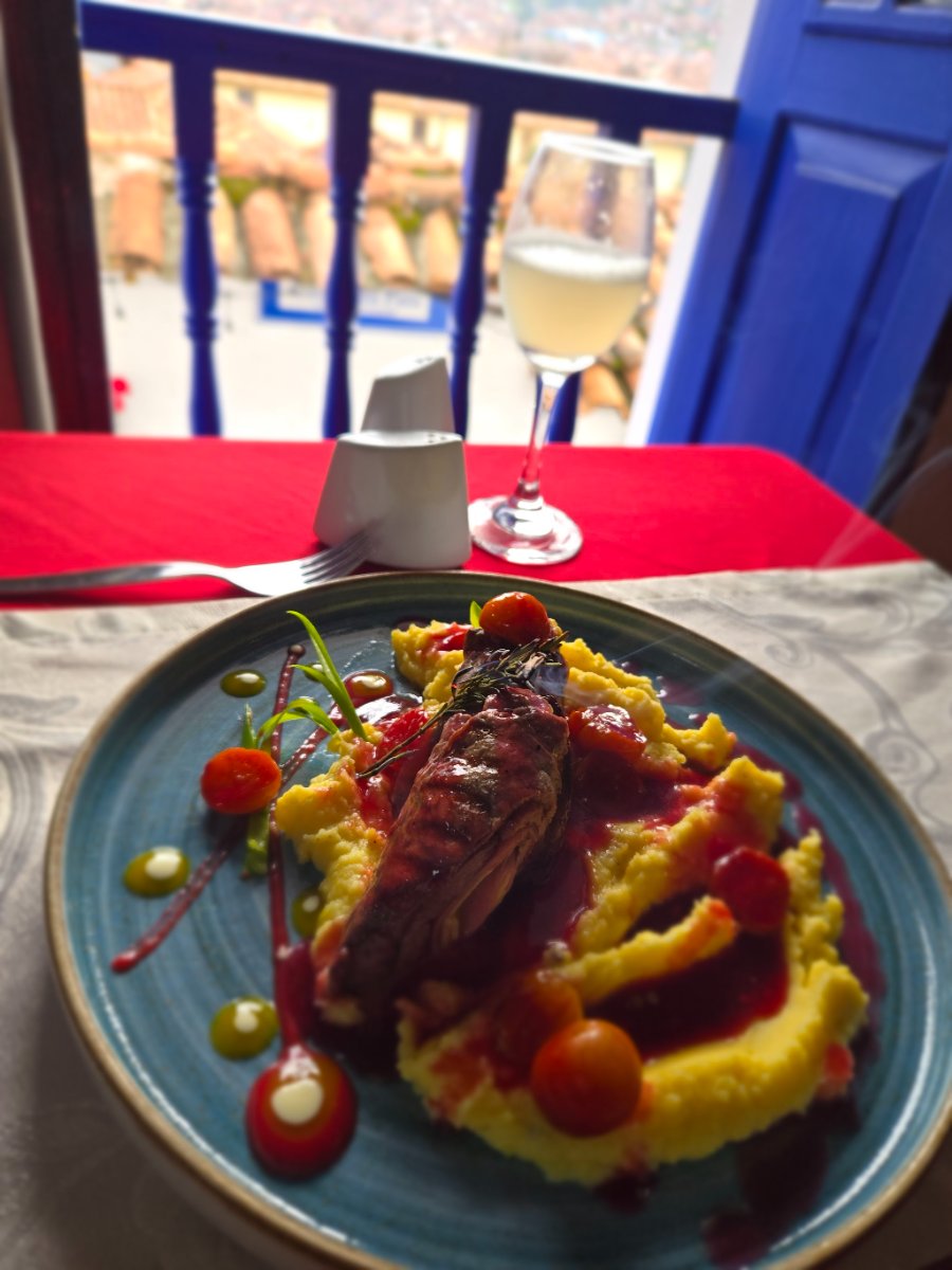 A cat sitting on a stack of eggs in a market stall